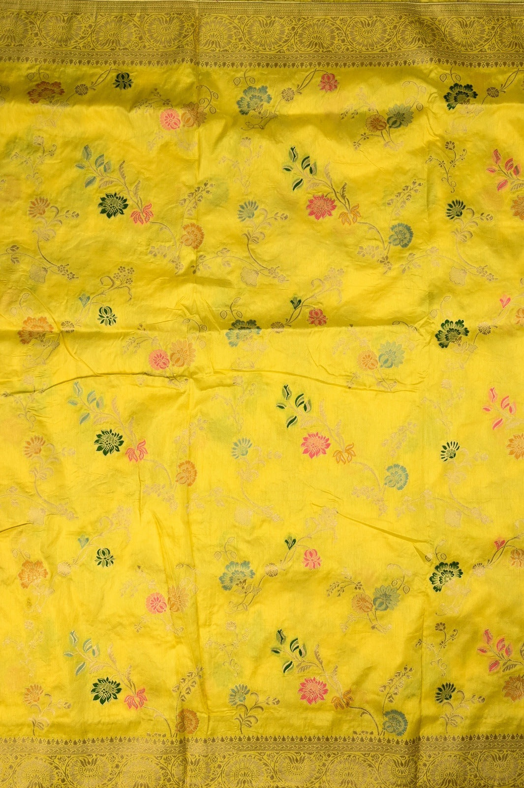 Dola silk saree light yellow color with allover zari work, rich pallu, small zari border and running plain blouse.
