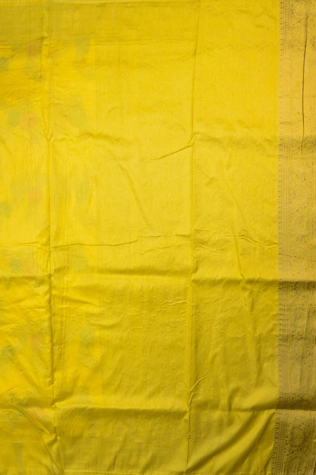Dola silk saree light yellow color with allover zari work, rich pallu, small zari border and running plain blouse.