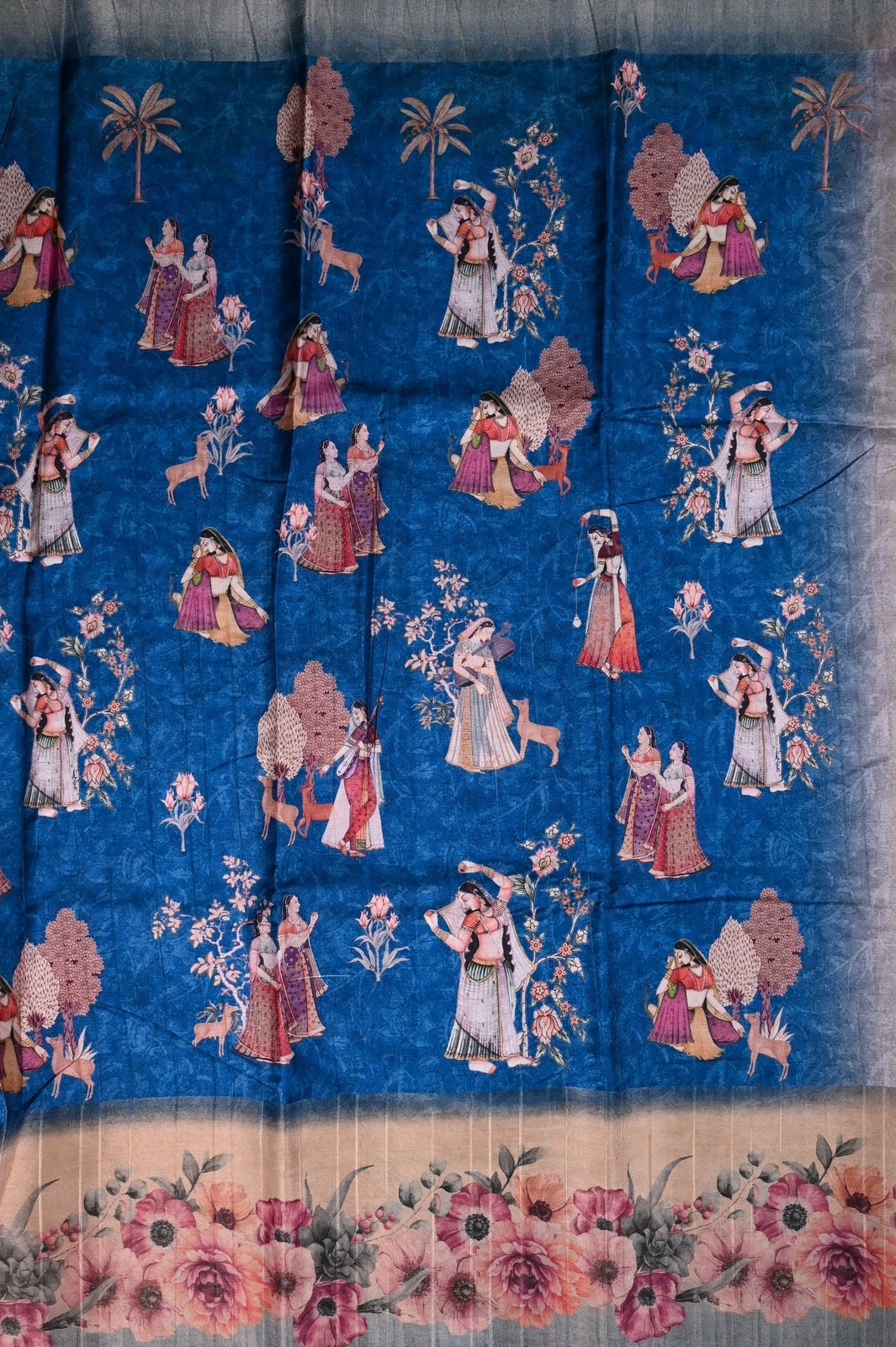 Fancy tussar saree blue color with allover prints, big floral border with printed pallu and blouse