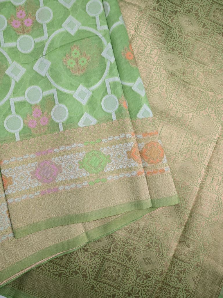 Dupion fancy saree pista green color allover zari weaves & zari border with rich pallu and attached plain blouse