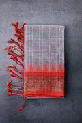 Dhaka cotton grey and red color with allover checks, small zari border, short pallu and contrast checks blouse