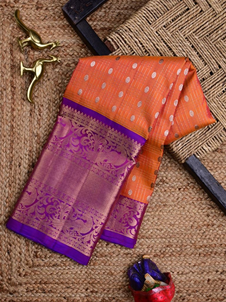 Kanchi pattu saree orange color allover zari motifs & kanchi border with rich pallu and contrast blouse