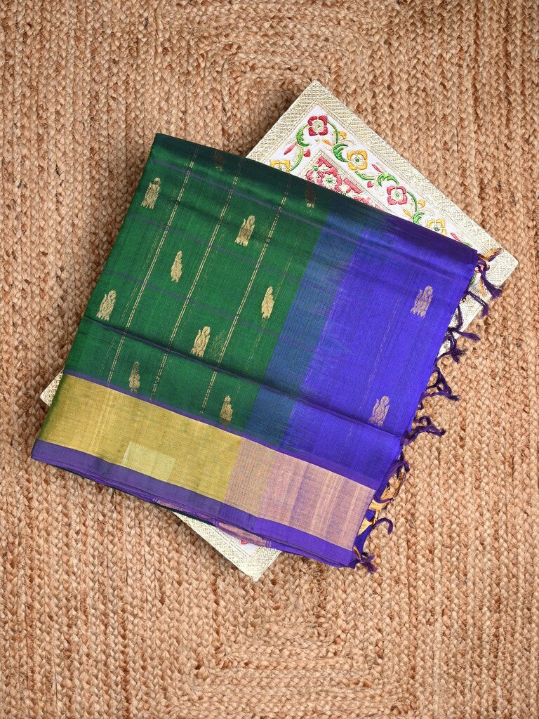 Uppada seiko pattu saree bottle green color allover zari motifs & kaddi border with contrast zari pallu and attached plain blouse