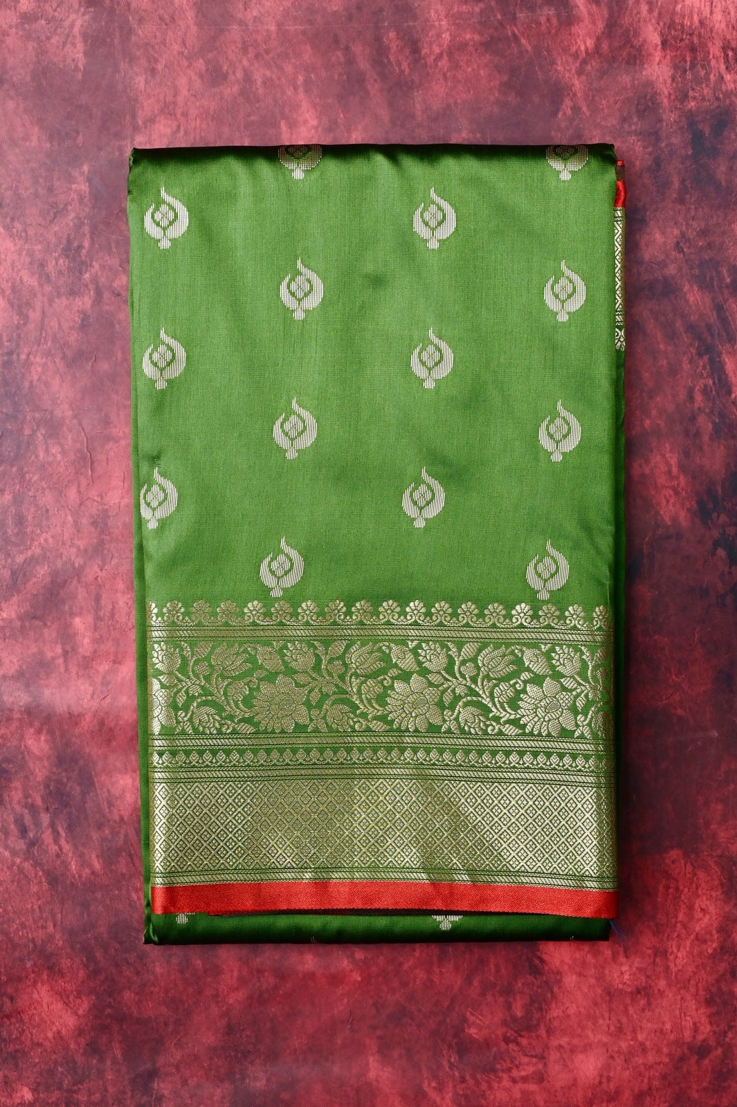 Banaras saree light green color with allover zari motive weaves, contrast pallu, big zari border and plain blouse.