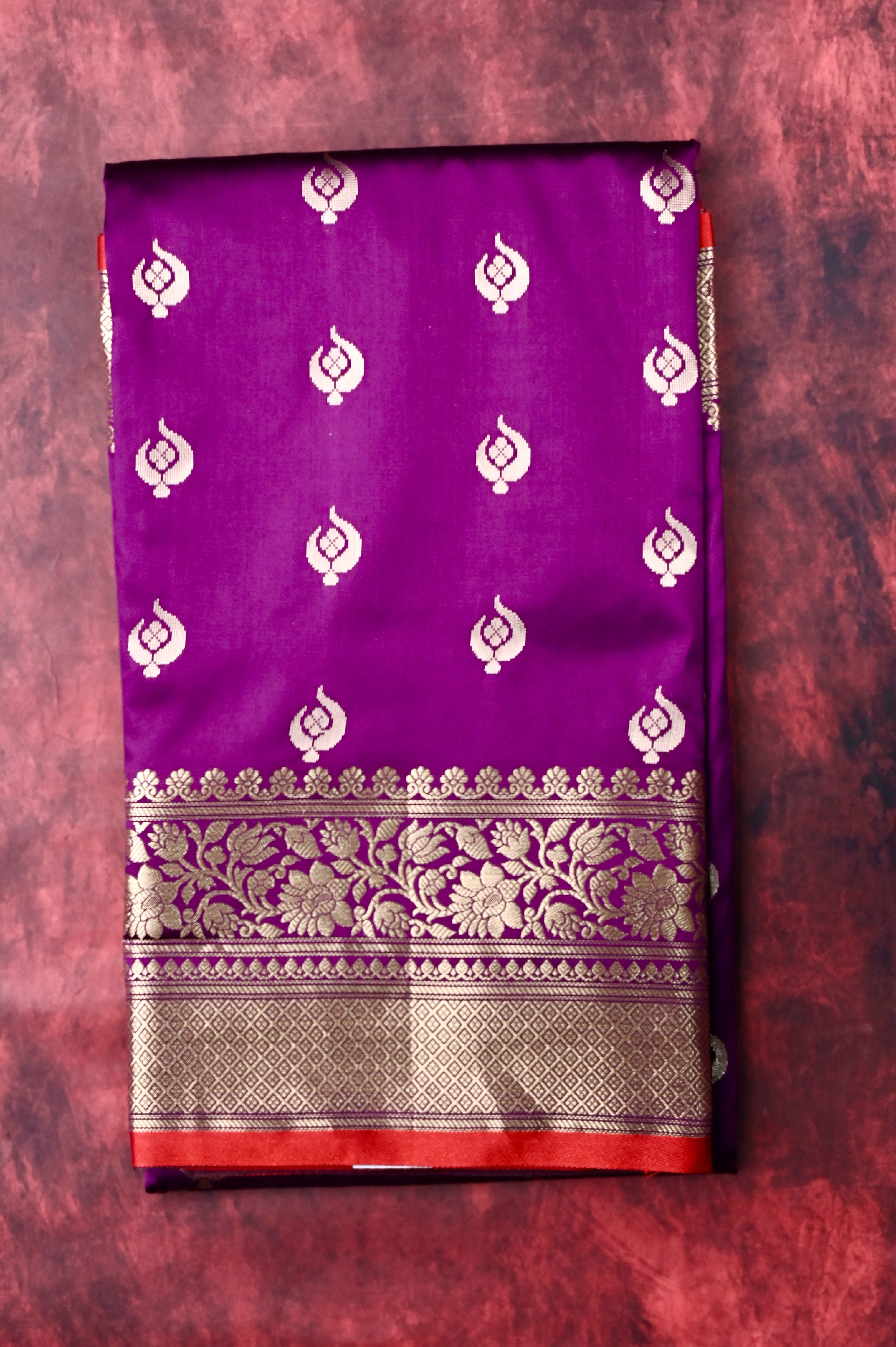 Banaras saree purple color with allover zari motive weaves, contrast pallu, big zari border and plain blouse.