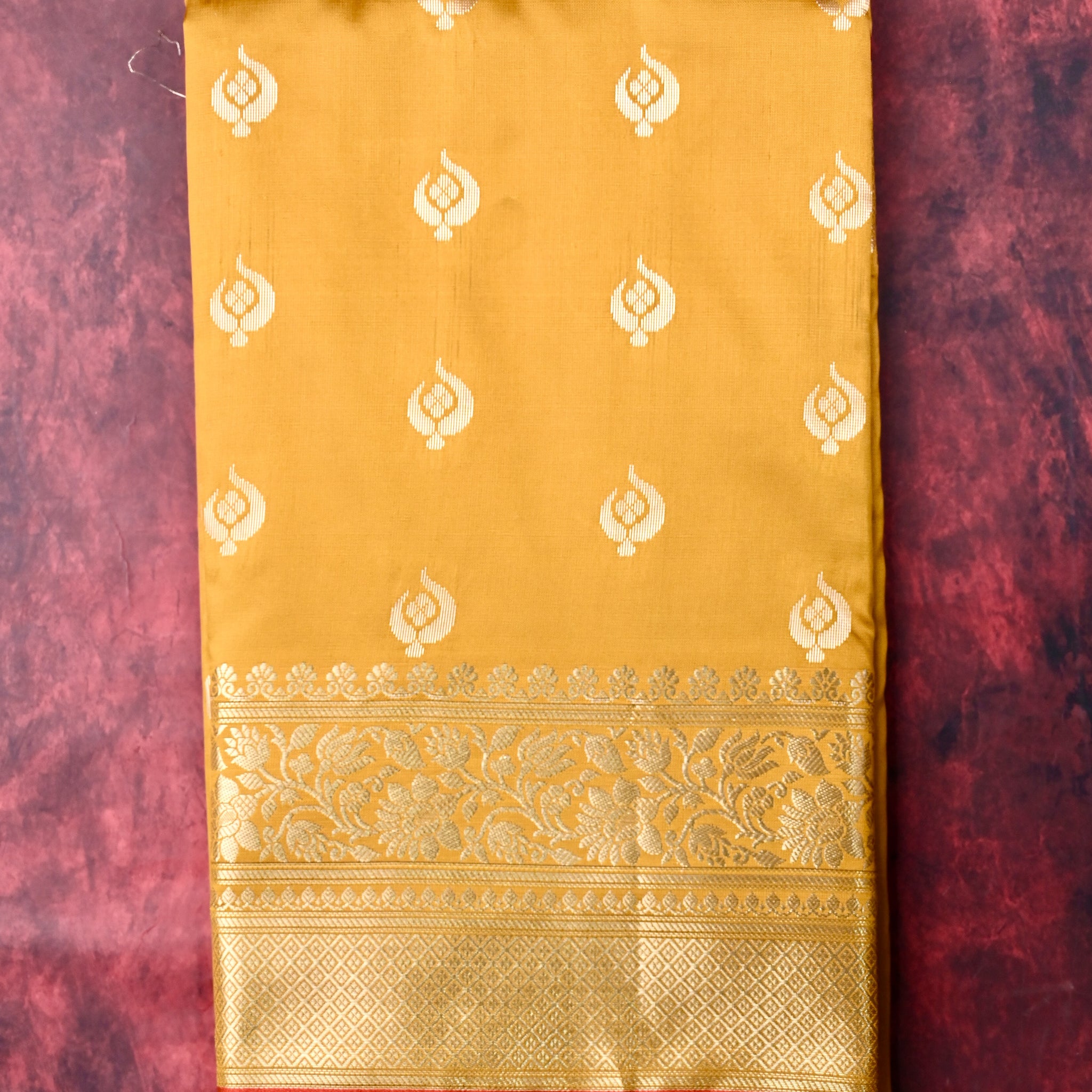 Banaras saree yellow color with allover zari motive weaves, contrast pallu, big zari border and plain blouse.