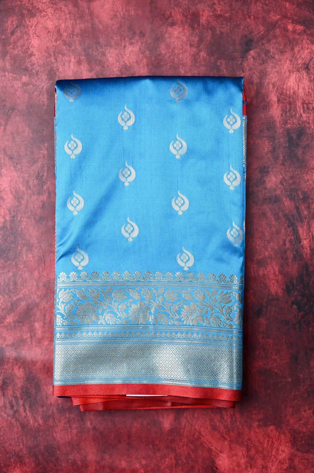 Banaras saree light blue color with allover zari motive weaves, contrast pallu, big zari border and plain blouse.