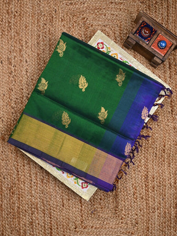 Uppada seiko pattu saree bottle green color allover zari motifs & kaddi border with zari contrast pallu and attached plain blouse