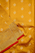 Banaras saree yellow color with allover zari motive weaves, contrast pallu, big zari border and plain blouse.