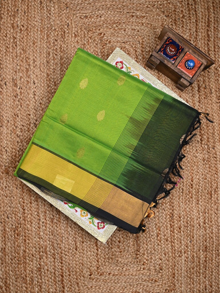 Uppada seiko pattu saree parrot green color allover zari motifs & kaddi border with zari contrast pallu and attached plain blouse