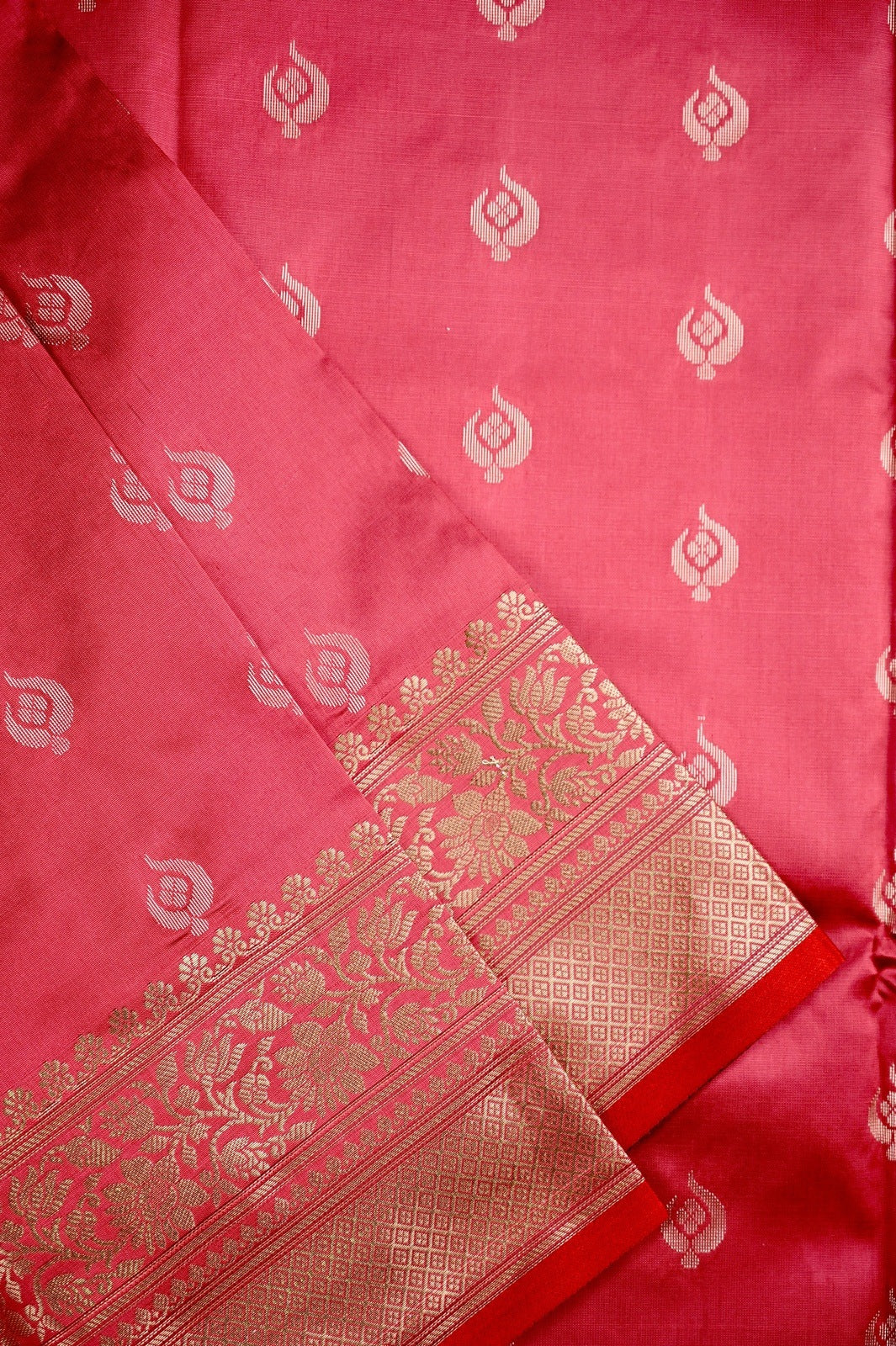 Banaras saree baby pink color with allover zari motive weaves, contrast pallu, big zari border and plain blouse.