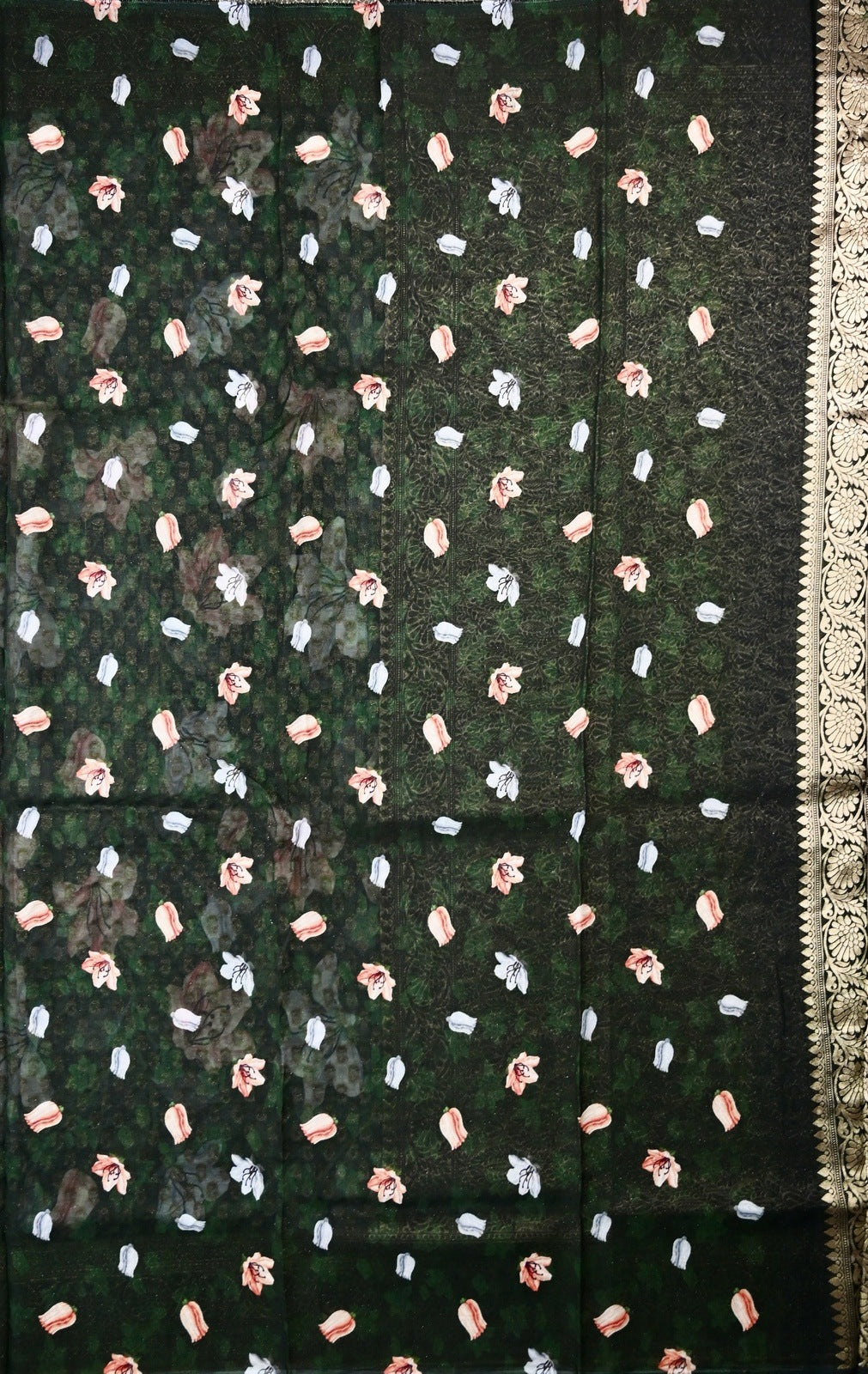 Georgette saree dark green color with allover zari motives and floral prints, small zari border, short pallu and printed blouse.