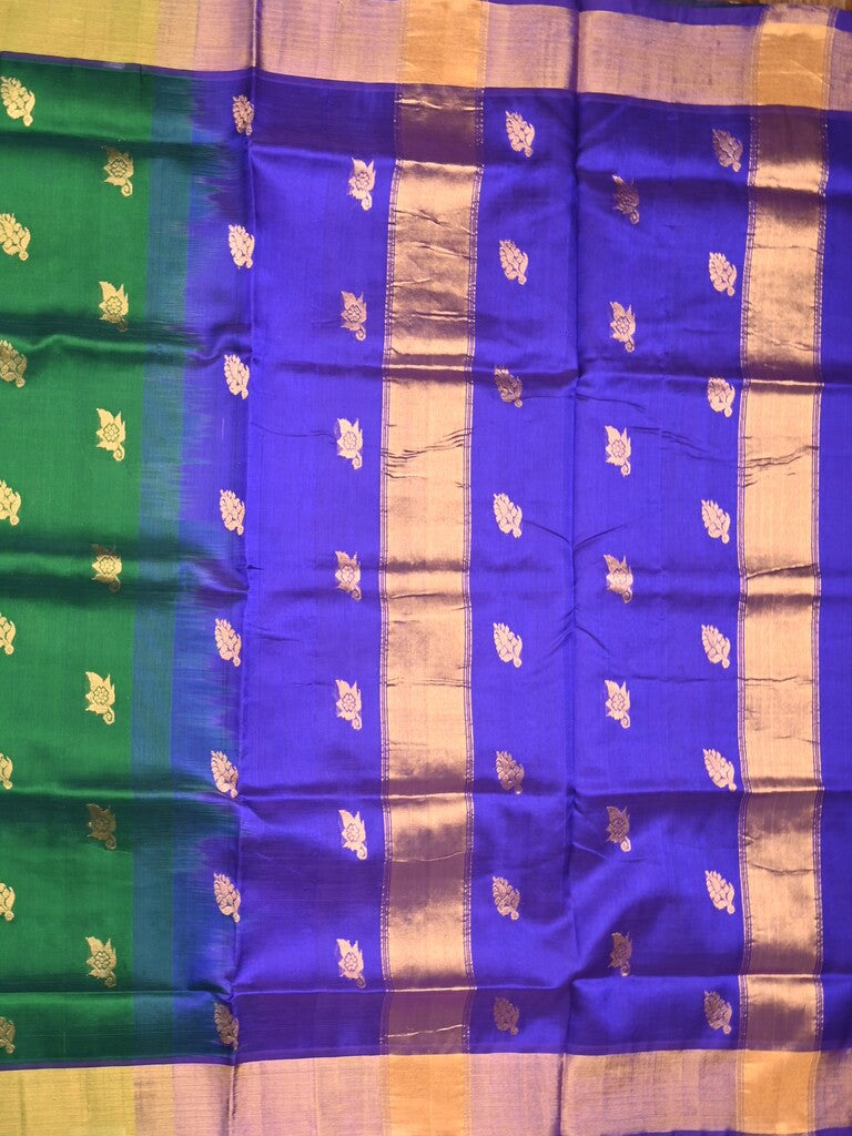 Uppada seiko pattu saree bottle green color allover zari motifs & kaddi border with zari contrast pallu and attached plain blouse