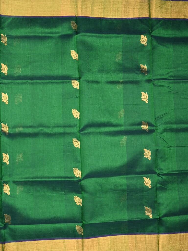 Uppada seiko pattu saree bottle green color allover zari motifs & kaddi border with zari contrast pallu and attached plain blouse