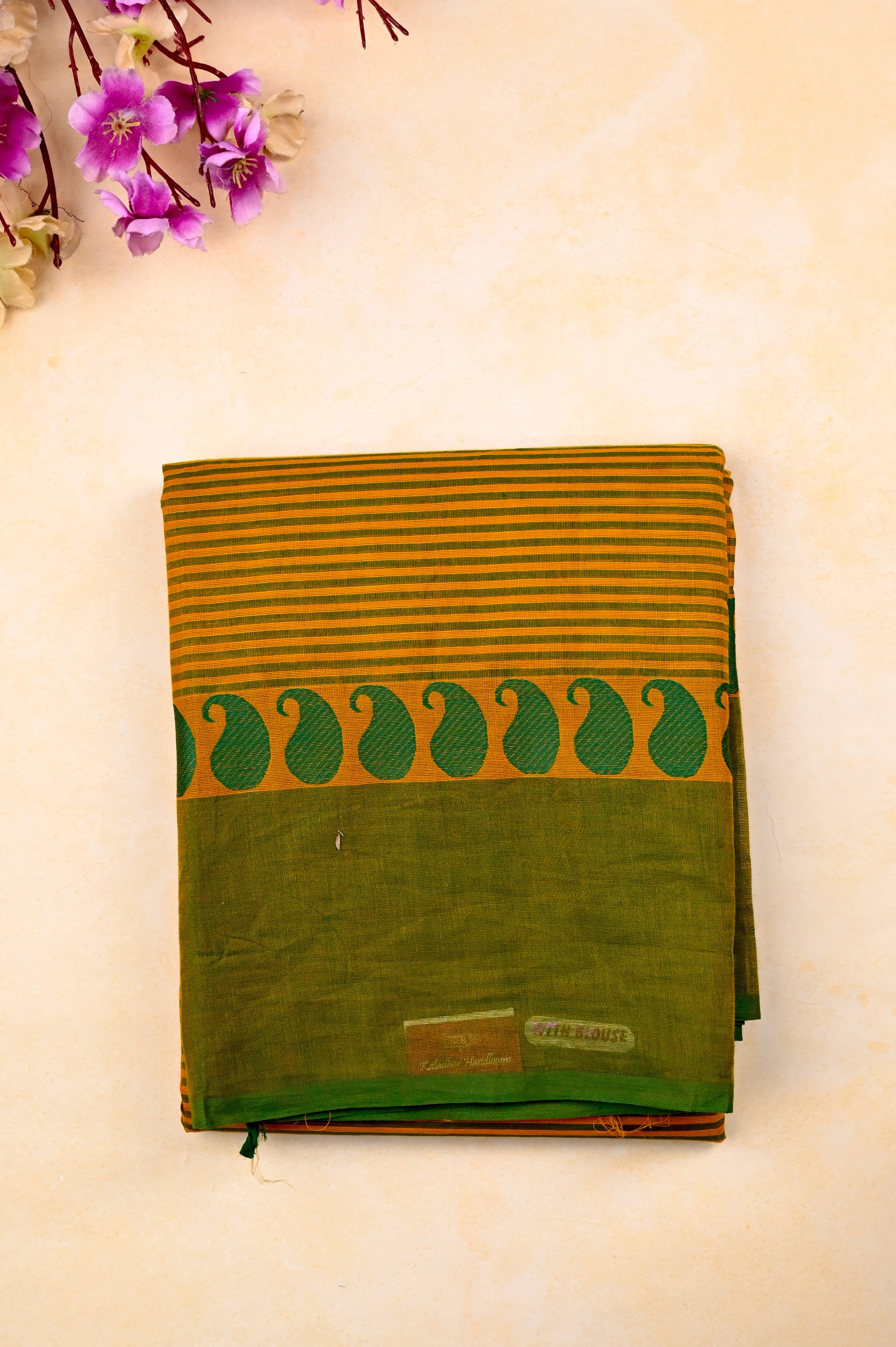 Kanchi cotton saree yellow color with allover lines, big kaddi border, short pallu and running blouse.