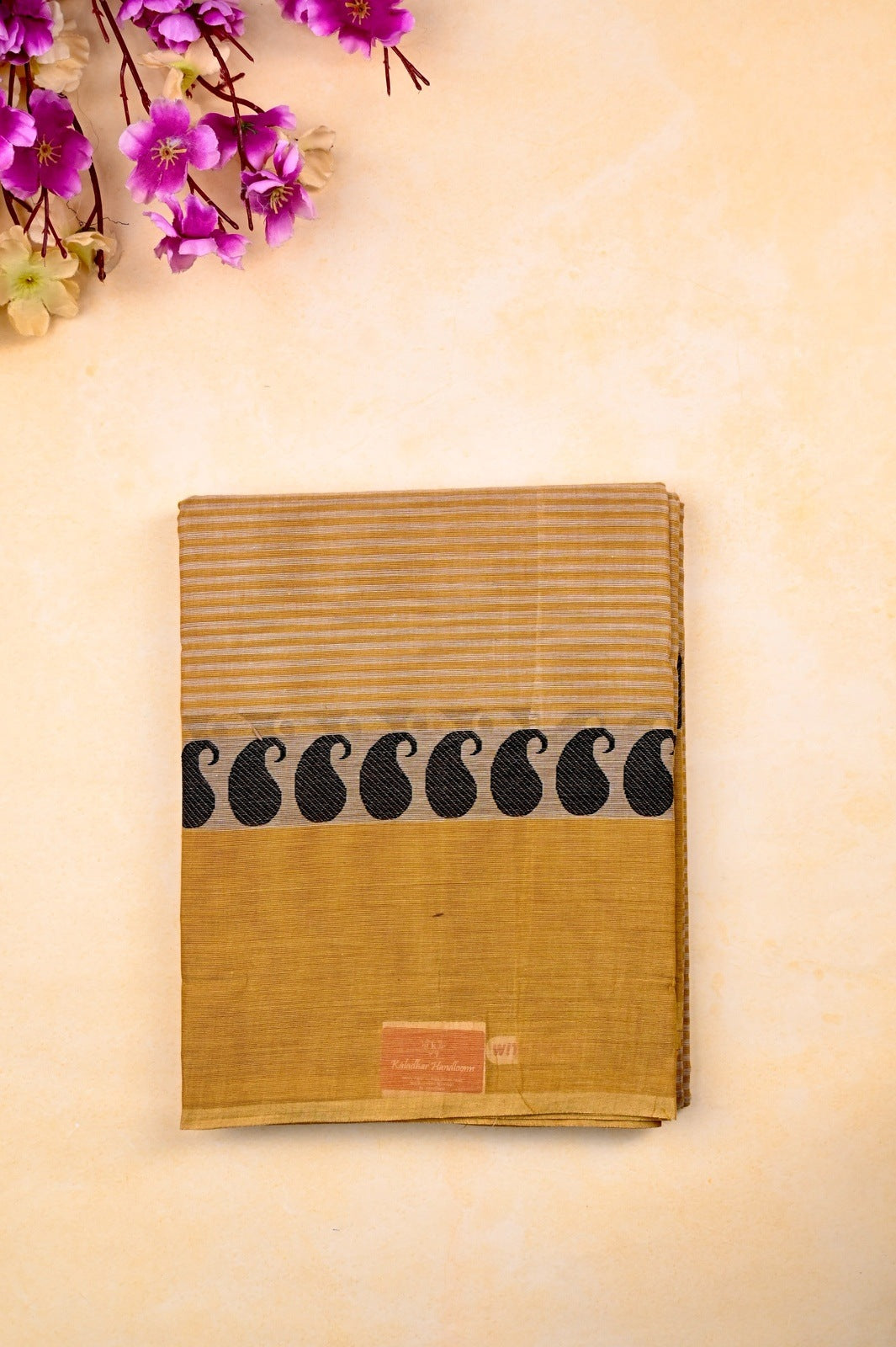Kanchi cotton saree dark cream color with allover lines, big kaddi border, short pallu and running blouse.