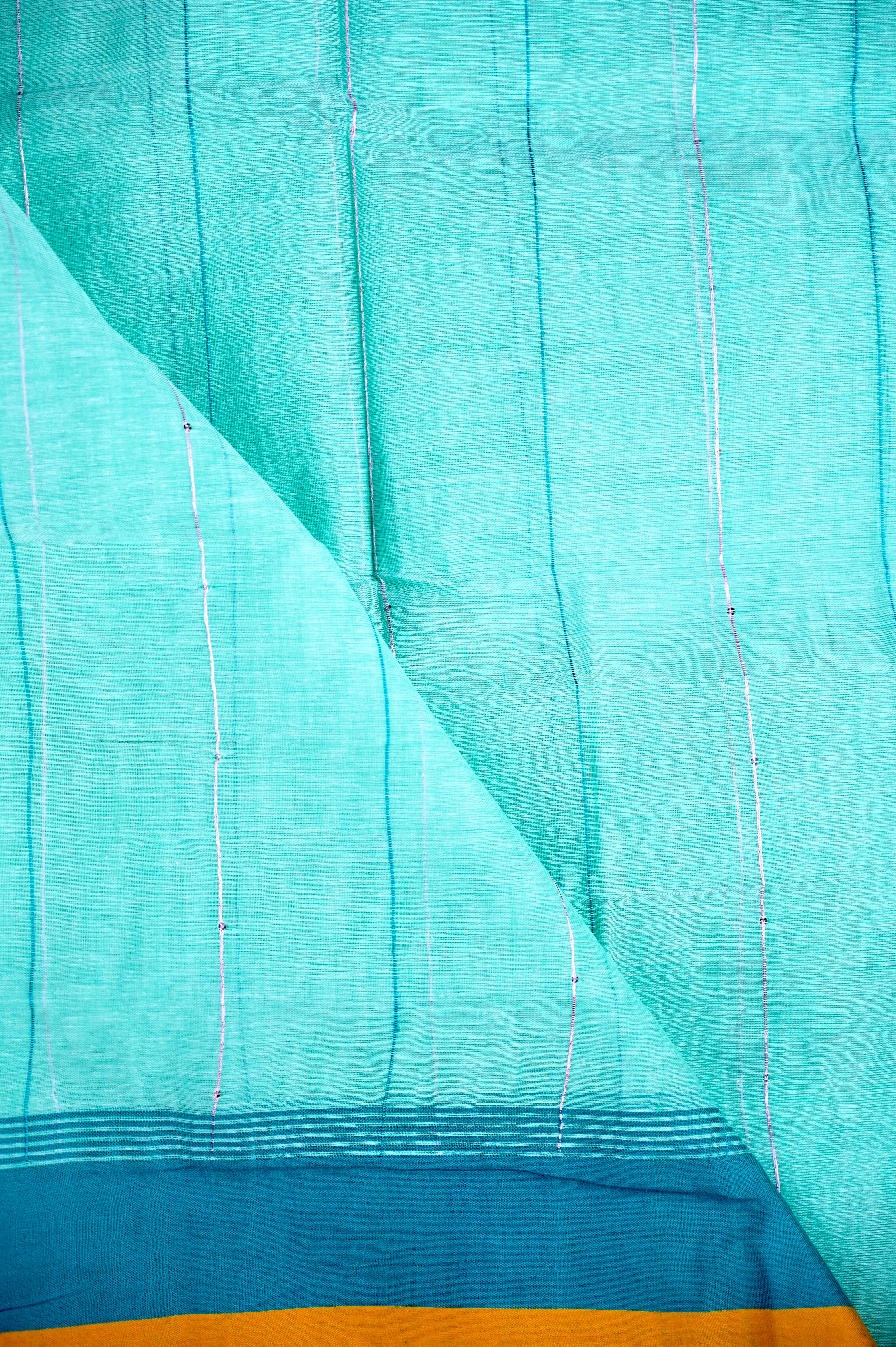 Jute cotton saree sea blue color with all over thread lines with sequence, big pallu, small contrast border and plain blouse.