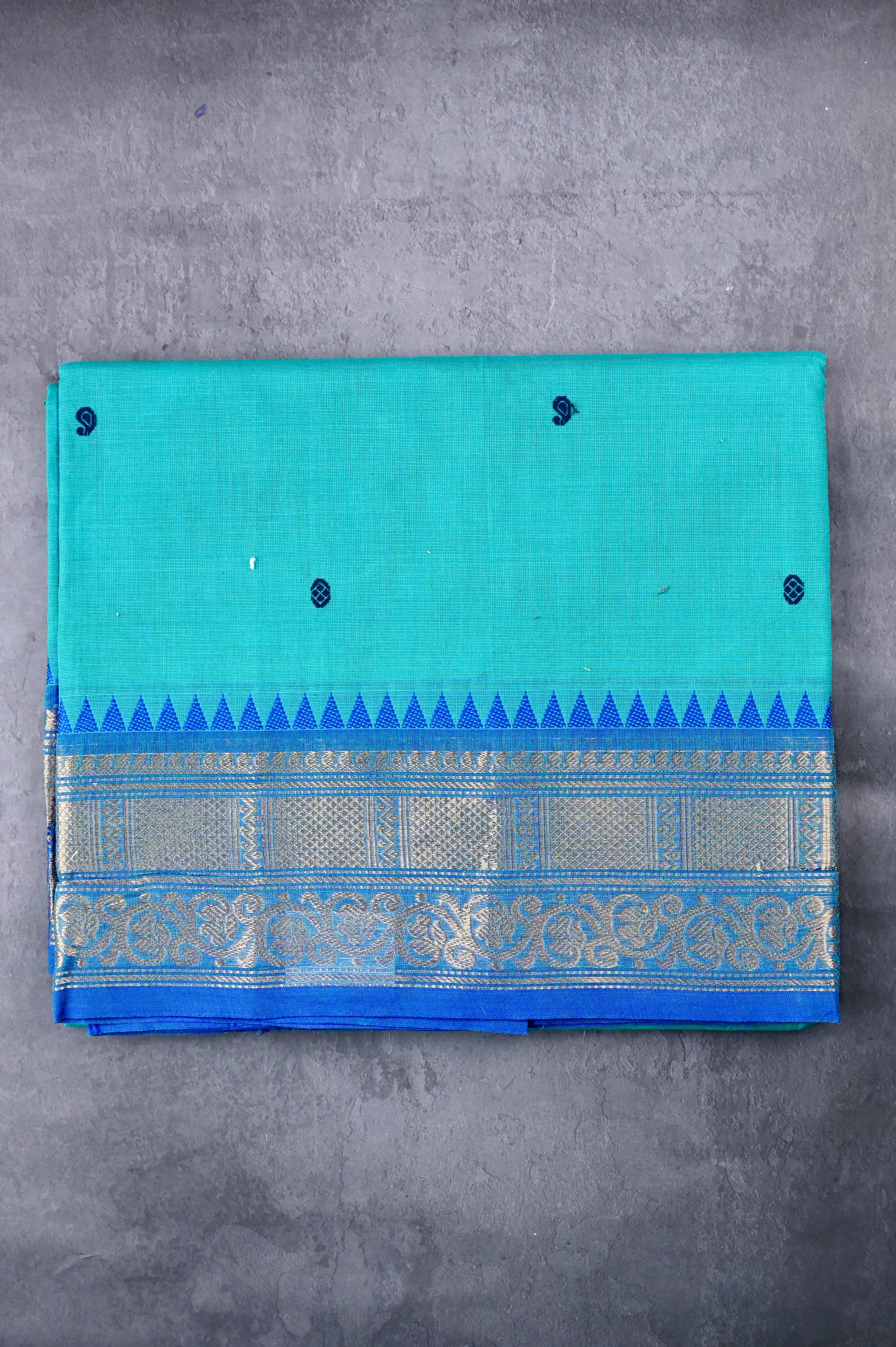 Kanchi cotton saree sea blue color with running pallu, big zari border and plain blouse.