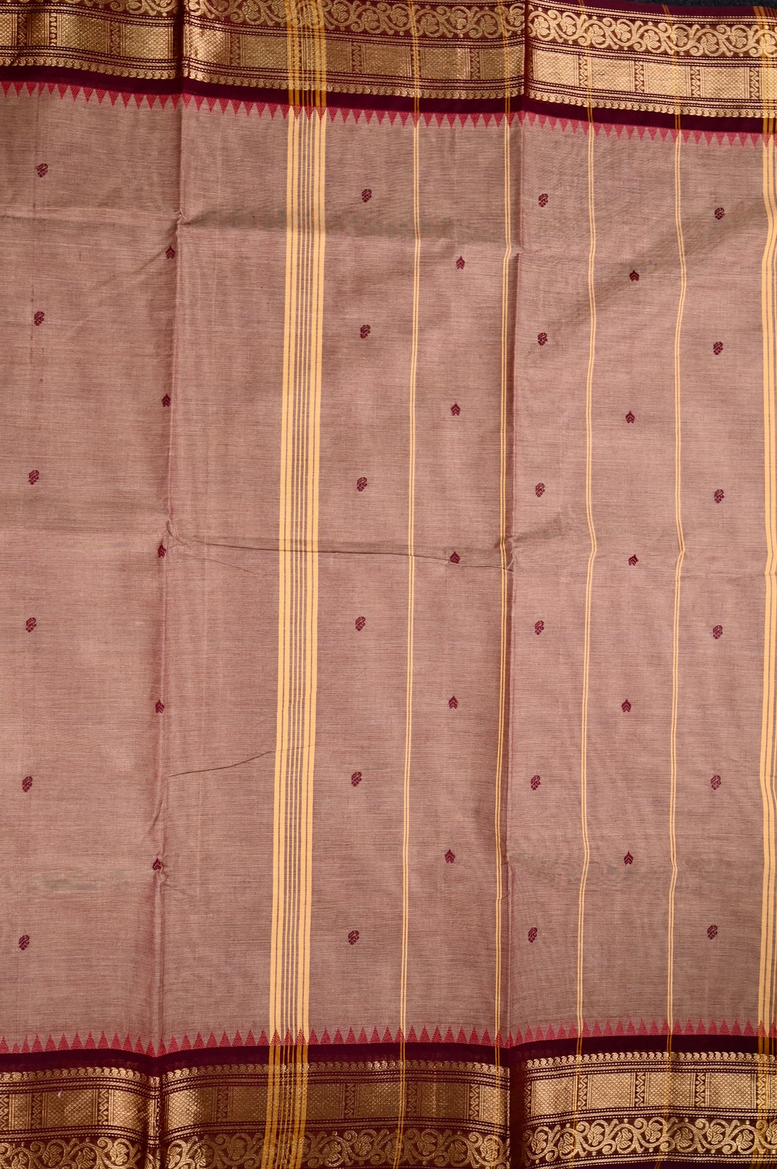 Kanchi cotton saree cream and maroon color with motives, running pallu, big zari border and plain blouse.