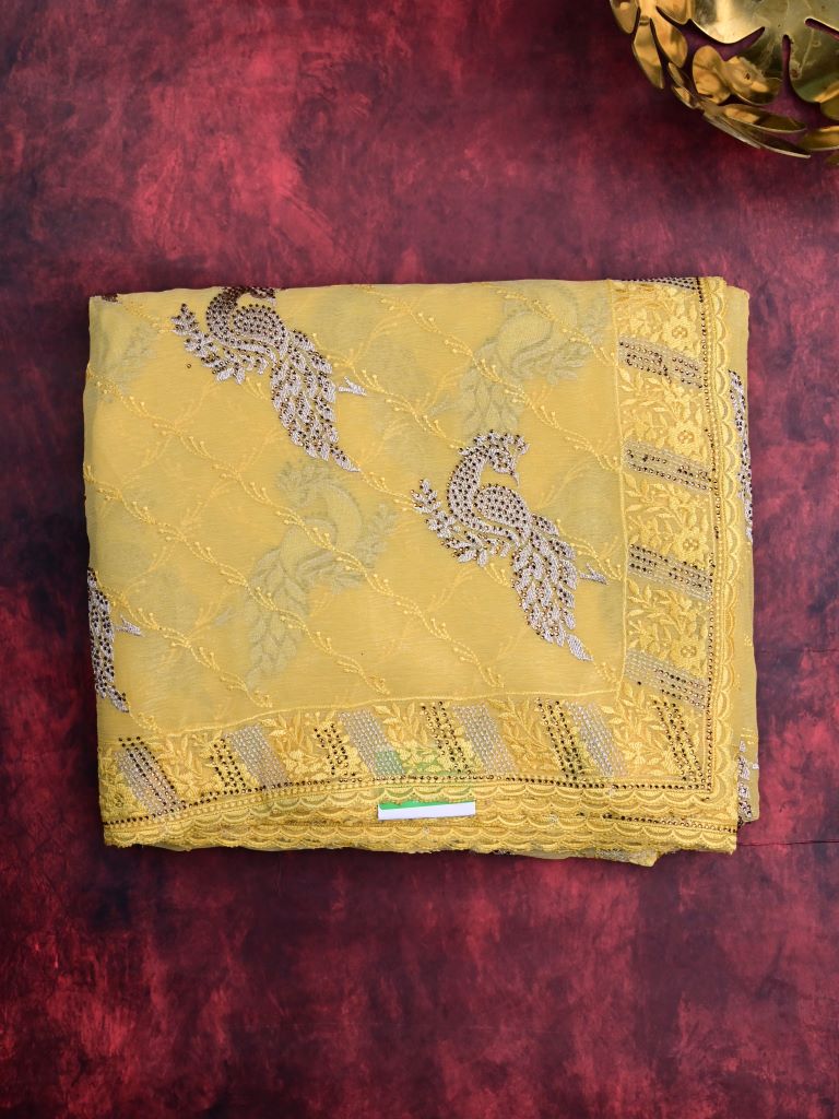 Chiffon fancy saree light yellow color allover embroidery & embroidery border with running pallu and attached fancy blouse