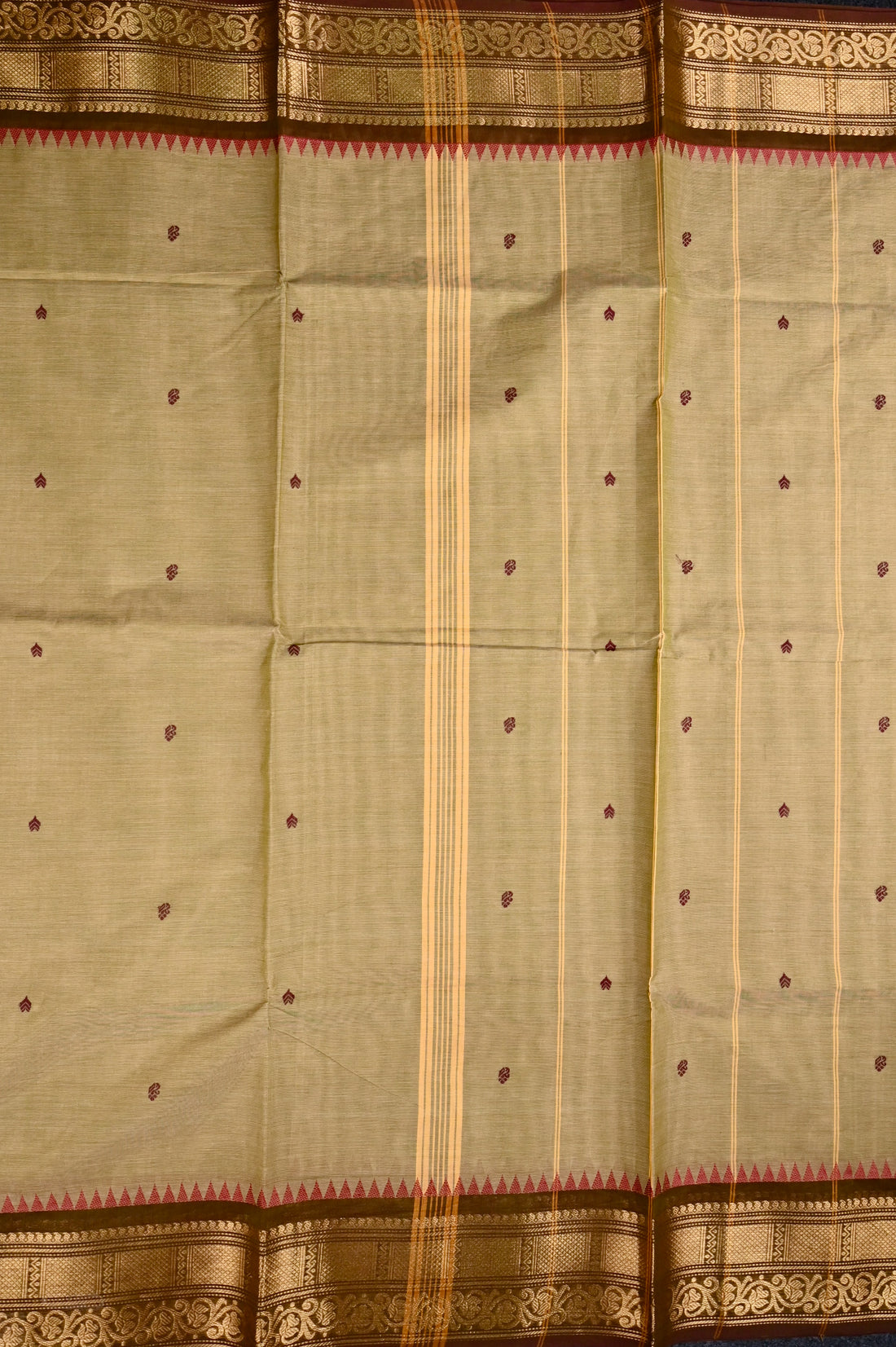 Kanchi cotton saree olive green color with motives, running pallu, big zari border and plain blouse.