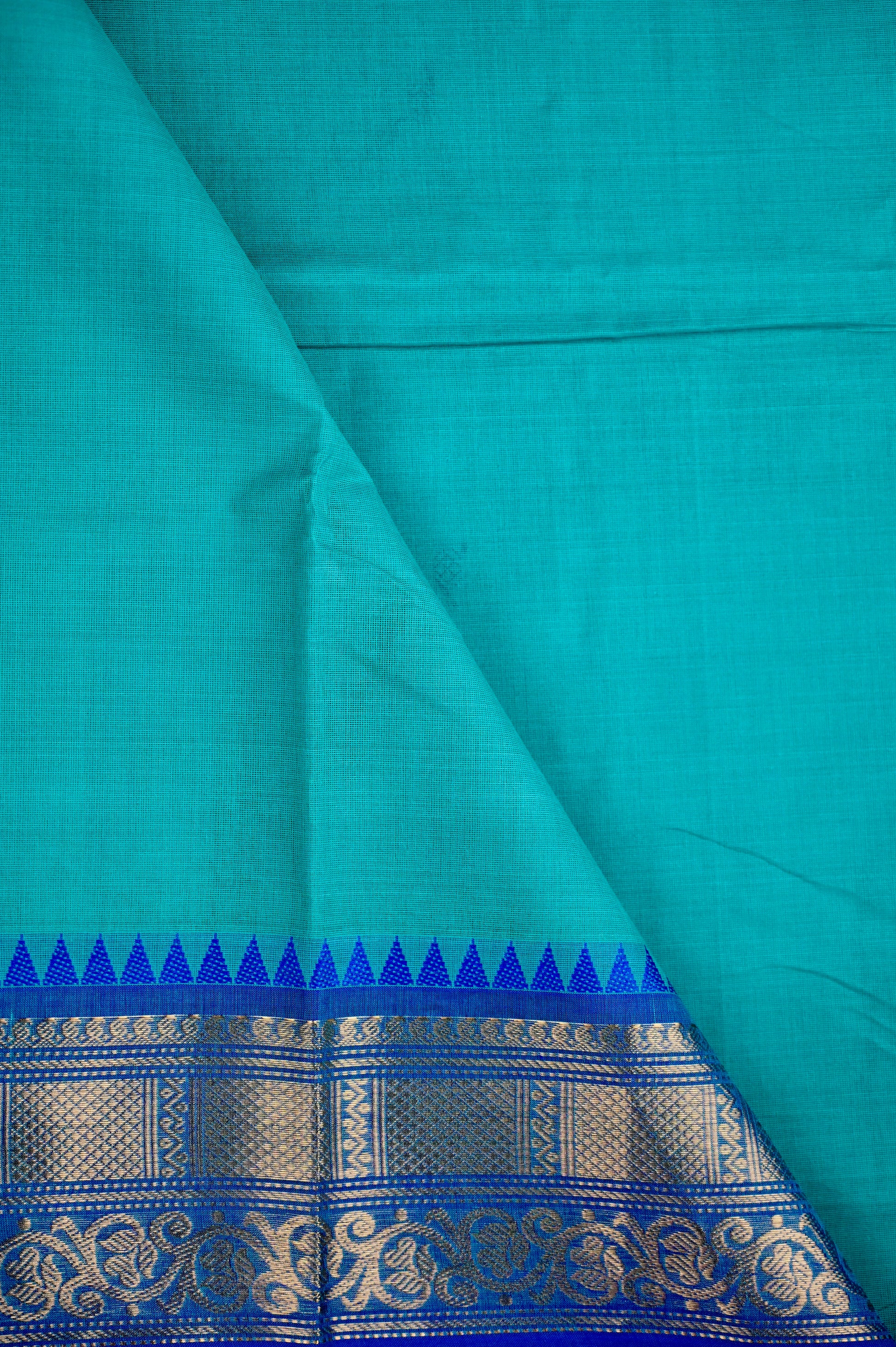 Kanchi cotton saree sea blue color with running pallu, big zari border and plain blouse.