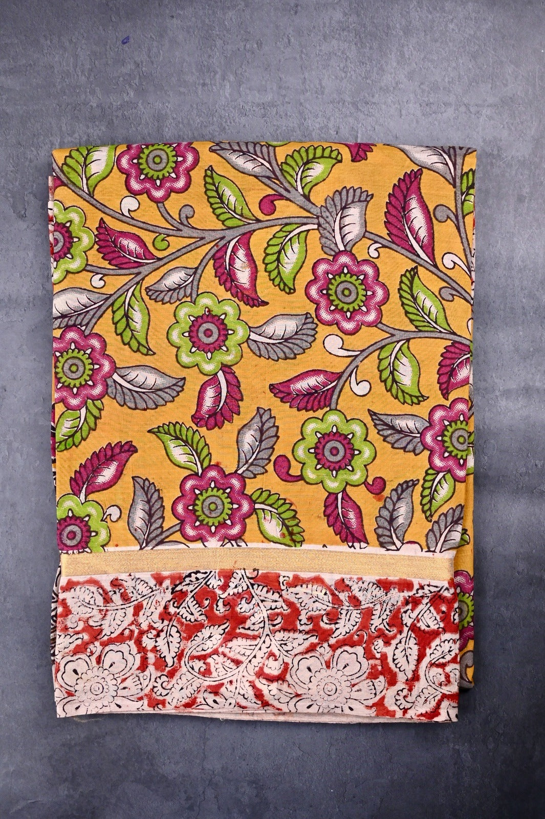 Kalamkari silk saree yellow color with allover kalamkari multi color prints, with big pallu, small border and printed blouse.
