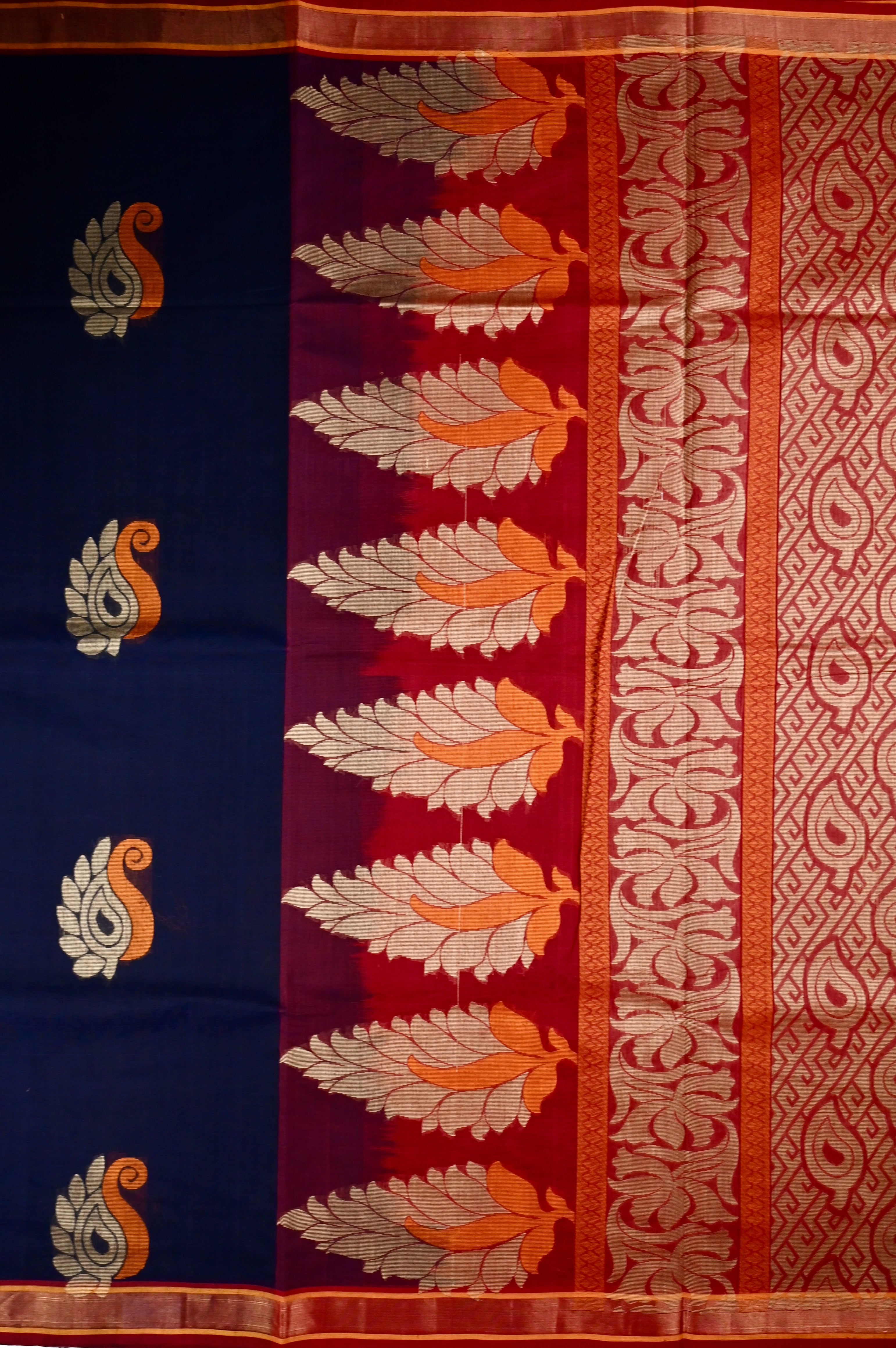 Kanchi cotton saree navy blue color with thread motive weaves, small zari border, contrast pallu and plain blouse.