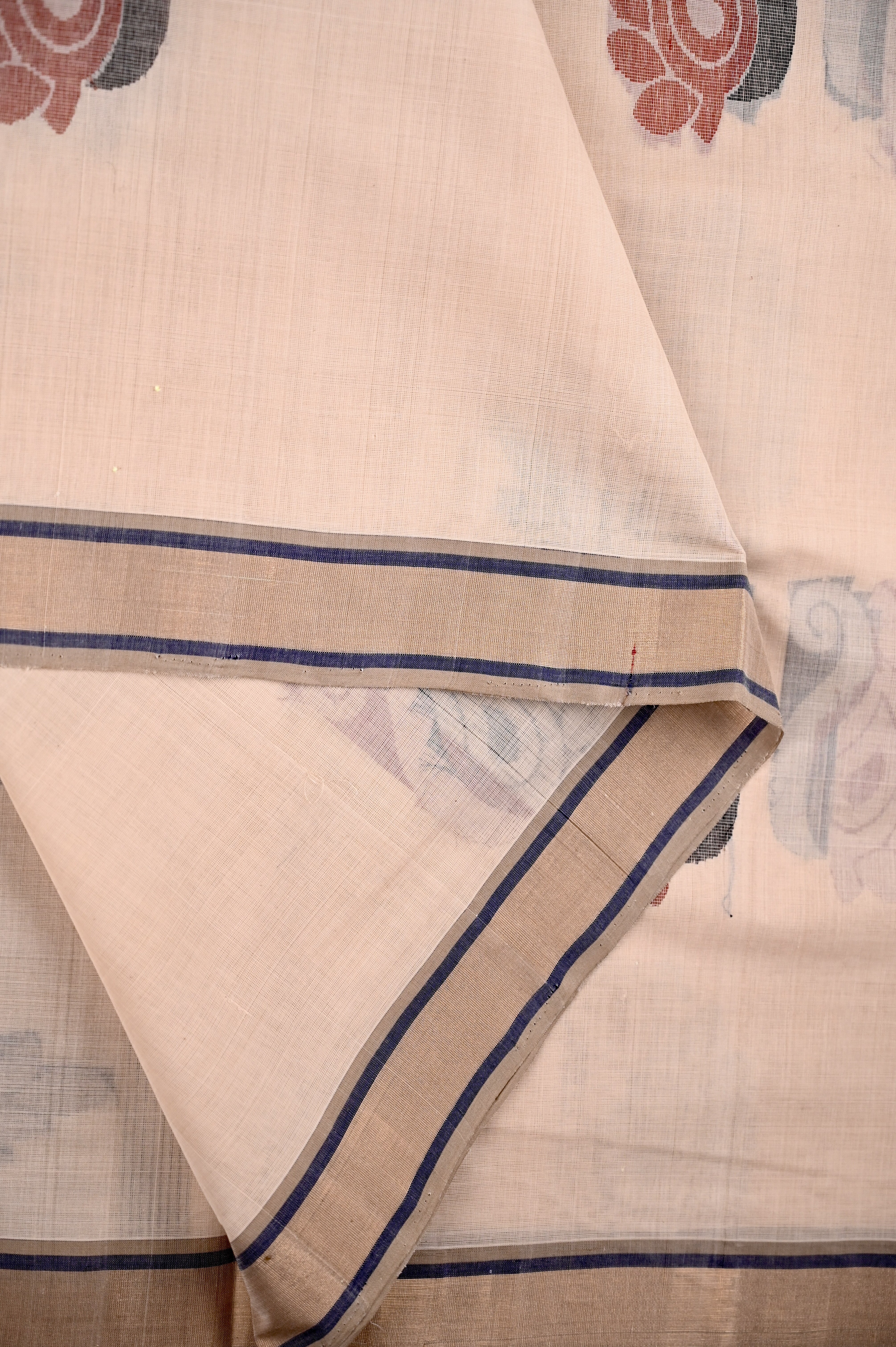 Kanchi cotton saree cream color with thread motive weaves, small zari border, contrast pallu and plain blouse.