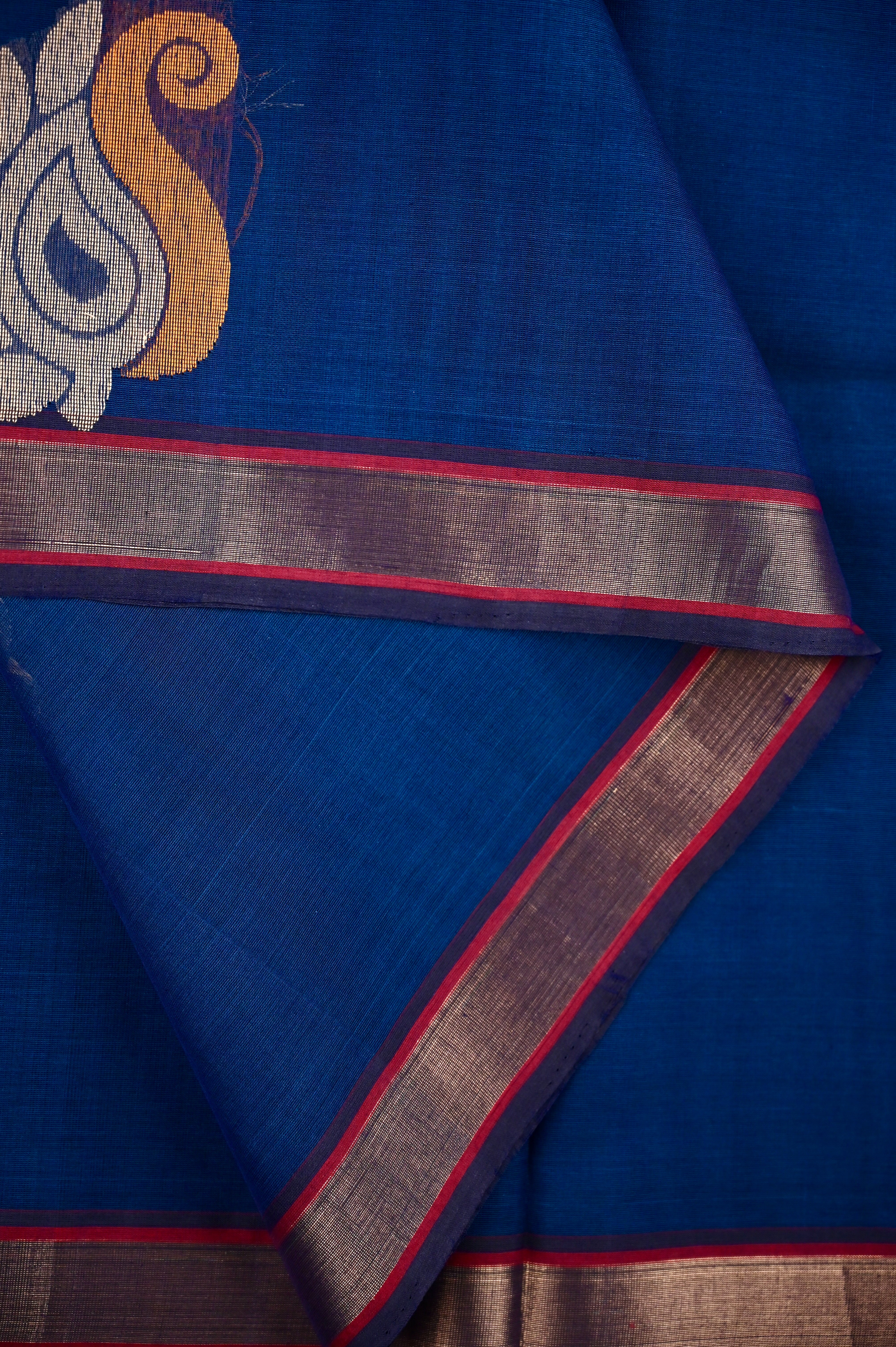 Kanchi cotton saree peacock blue color with thread motive weaves, small zari border, contrast pallu and plain blouse.