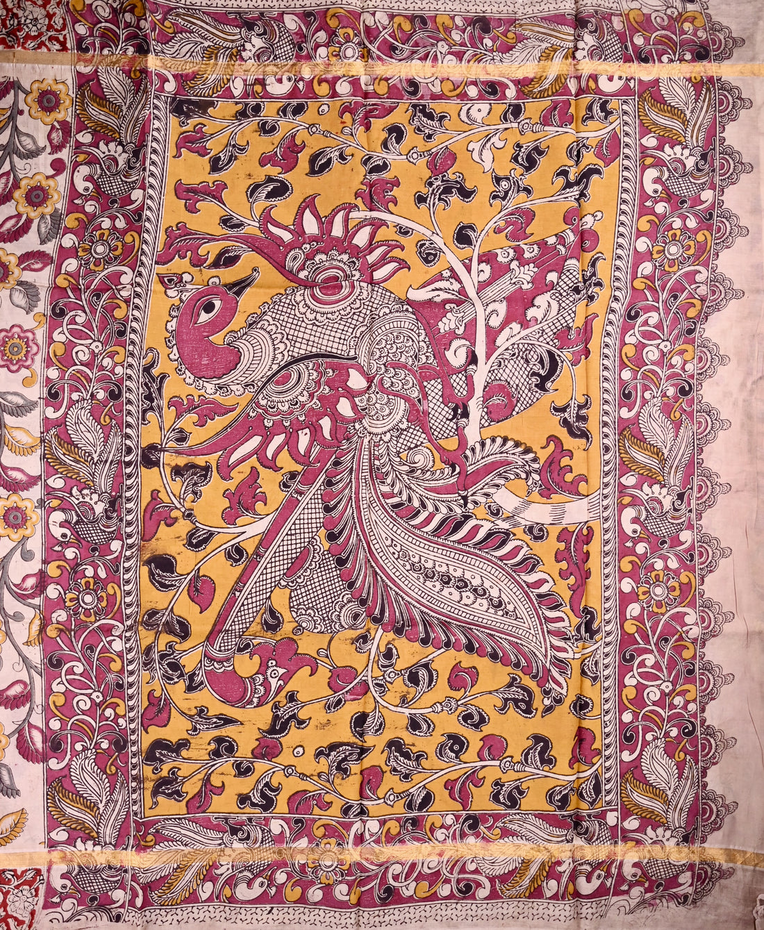 Kalamkari silk saree half white color with allover kalamkari multi color prints, with big pallu, small border and printed blouse.