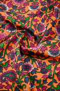 Kalamkari silk saree orange color with allover kalamkari multi color prints, with big pallu, small border and printed blouse.