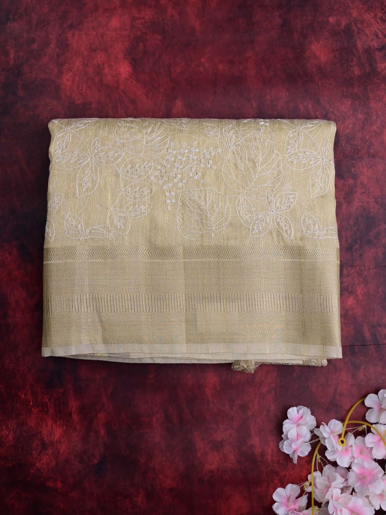 Jute tissue fancy sarees cream color allover embroidery & zari border with short pallu and attached plain blouse