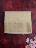 Jute tissue fancy sarees cream color allover embroidery & zari border with short pallu and attached plain blouse