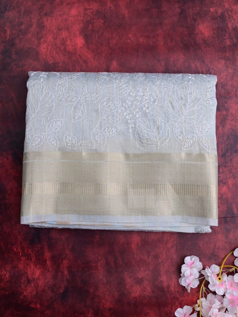 Jute tissue fancy sarees sea blue color allover embroidery & zari border with short pallu and attached plain blouse