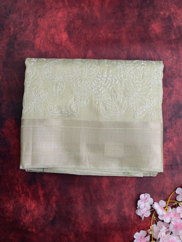 Jute tissue fancy sarees light pista green color allover embroidery & zari border with short pallu and attached plain blouse