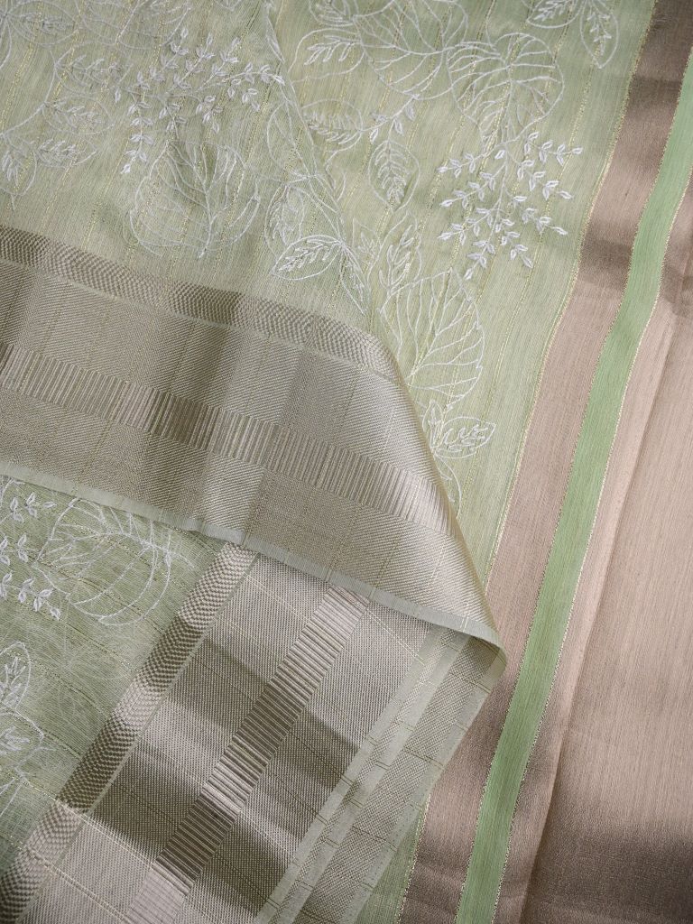 Jute tissue fancy sarees light pista green color allover embroidery & zari border with short pallu and attached plain blouse