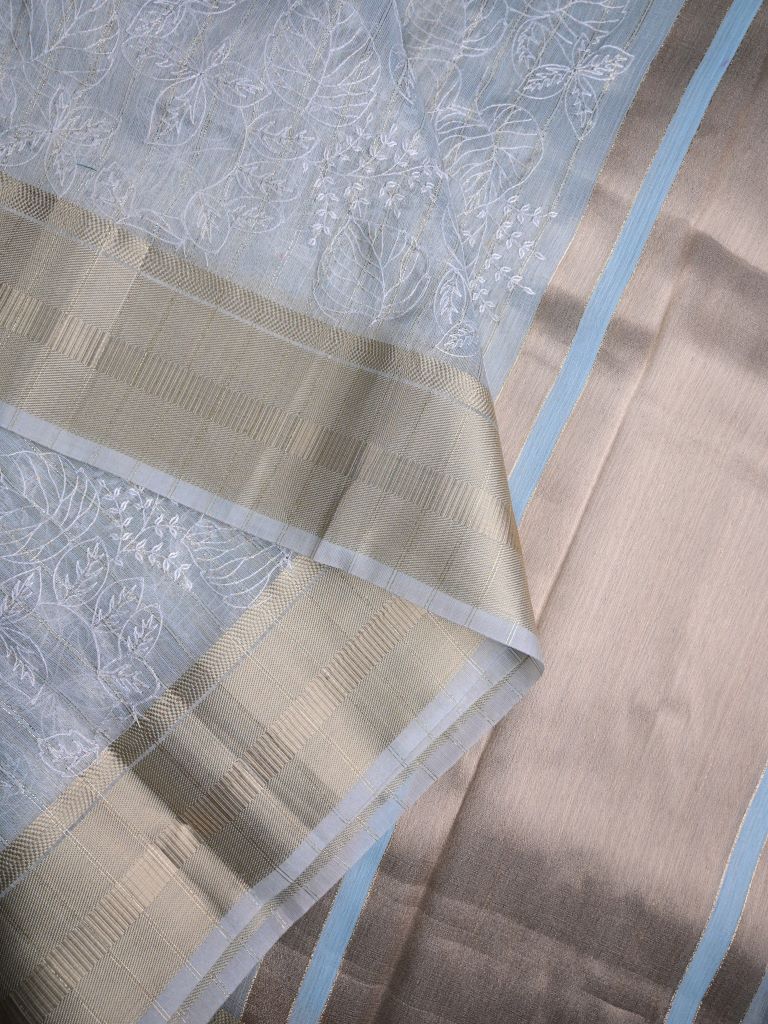 Jute tissue fancy sarees sea blue color allover embroidery & zari border with short pallu and attached plain blouse