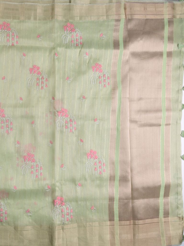 Lenin tissue fancy saree light pista green color allover weaves & zari border with short pallu and attached self blouse