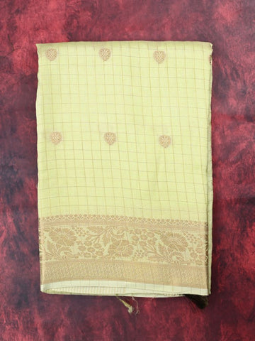 Dola silk fancy saree light yellow color allover zari motives & checks with short pallu and attached blouse