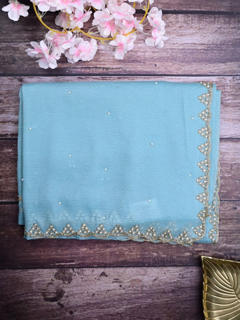 Chiffon crush fancy saree sky blue color allover stone work & embroidery border with running pallu and attached self blouse