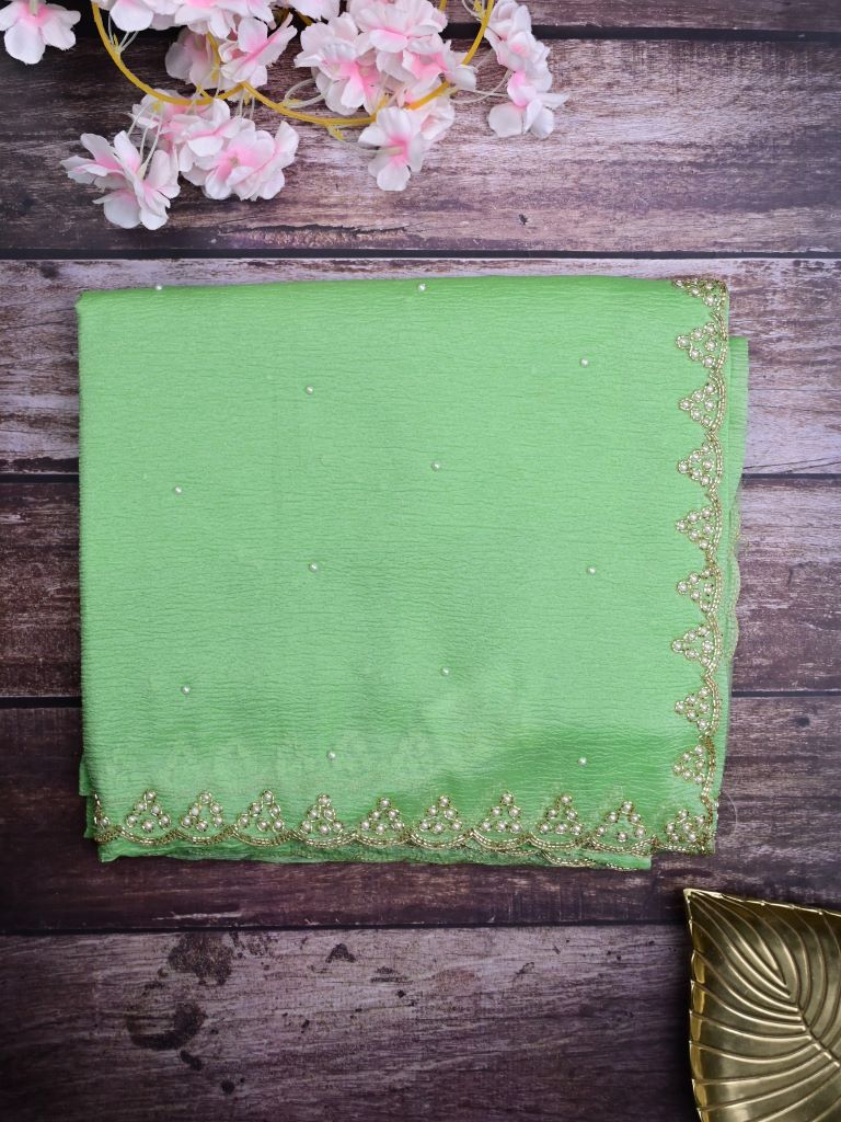 Chiffon crush fancy saree light green color allover stone work & embroidery border with running pallu and attached self blouse