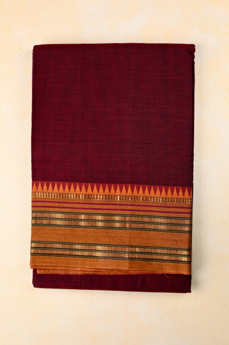 Narayanpet cotton saree maroon color with contrast zari border, short pallu and plain blouse.
