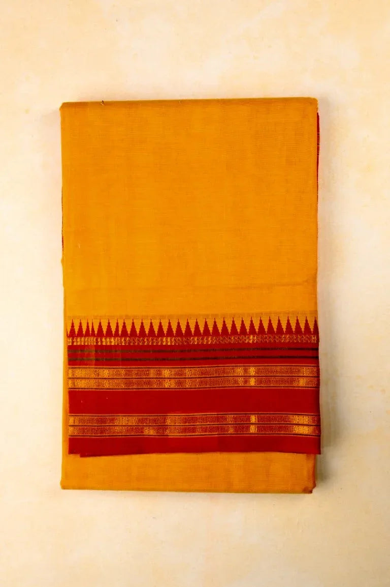 Narayanpet cotton saree yellow color with contrast zari border, short pallu and plain blouse.