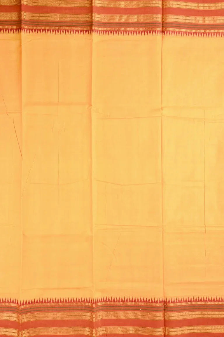 Narayanpet cotton saree yellow color with contrast zari border, short pallu and plain blouse.