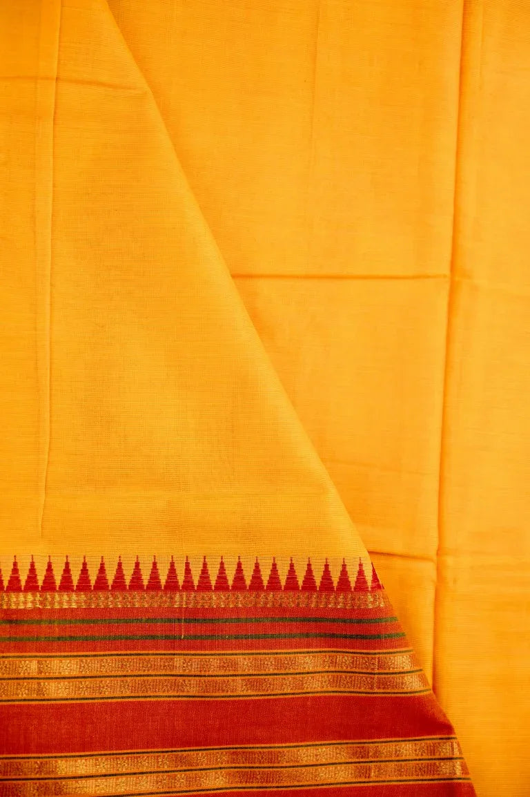 Narayanpet cotton saree yellow color with contrast zari border, short pallu and plain blouse.