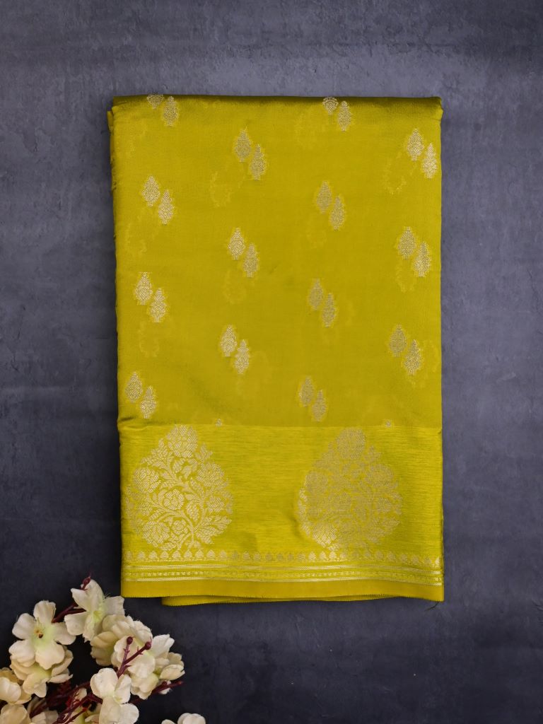 Chiniya silk fancy saree lime green color allover zari motifs & zari border with short pallu and attached brocade blouse