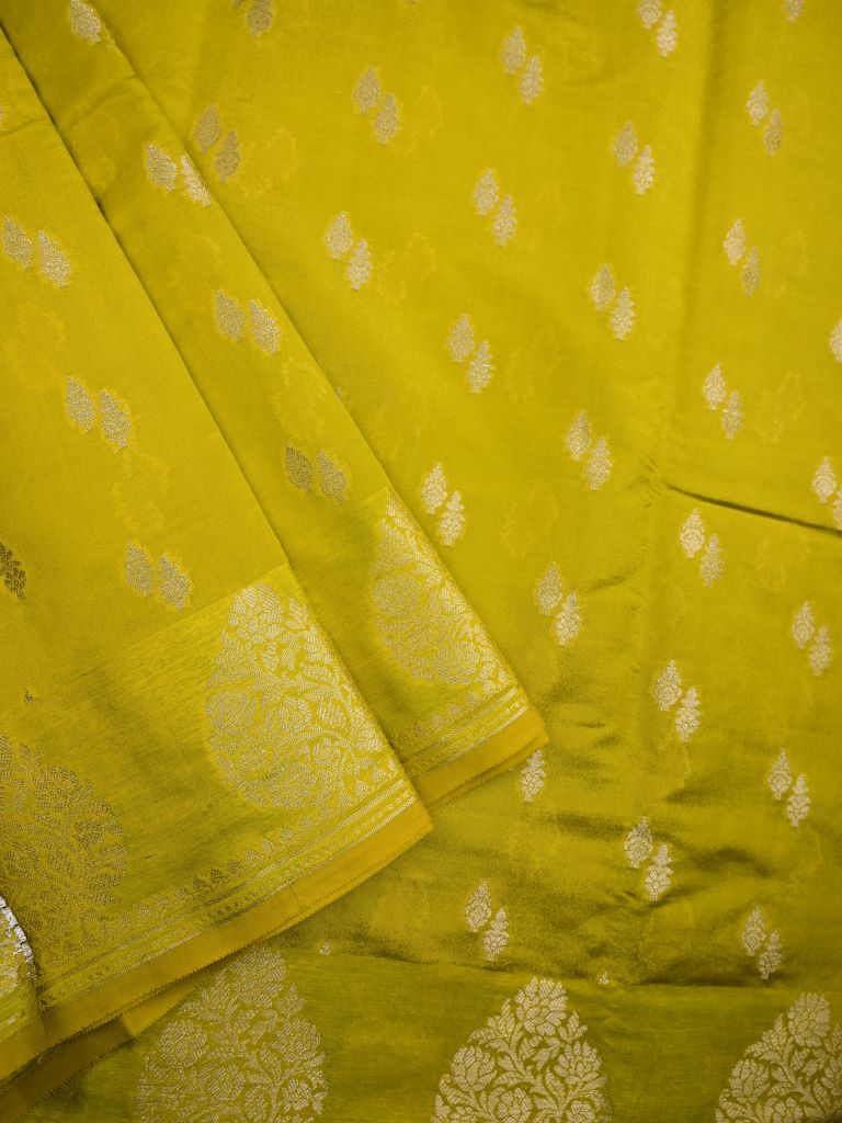 Chiniya silk fancy saree lime green color allover zari motifs & zari border with short pallu and attached brocade blouse