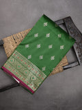 Banaras fancy saree bottle green color allover zari motifs & zari border with rich pallu and contrast plain blouse