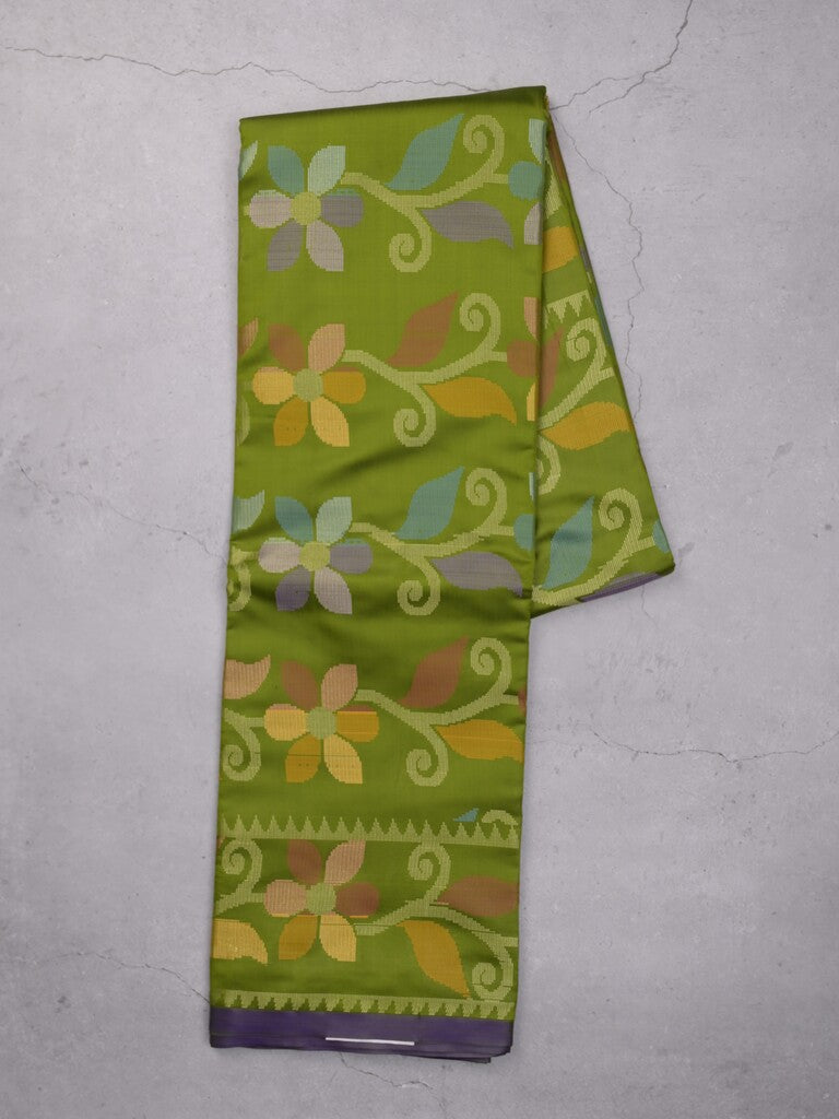 Fancy pattu saree parrot green color allover weaves & small border with self pallu and attached blouse